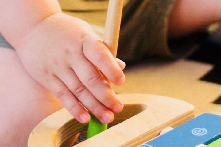 Child Playing with Xylophone